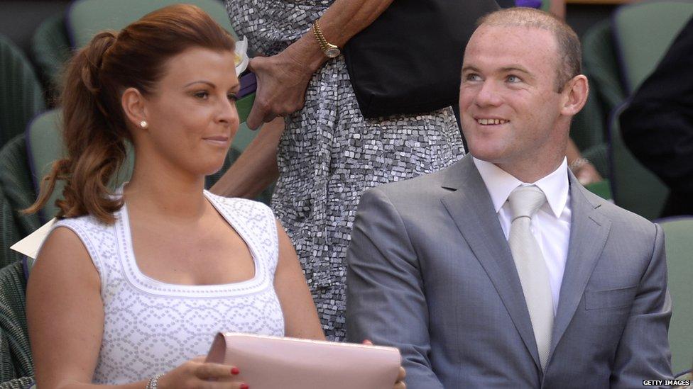 Colleen and Wayne Rooney await the start of the 2013 Wimbledon final