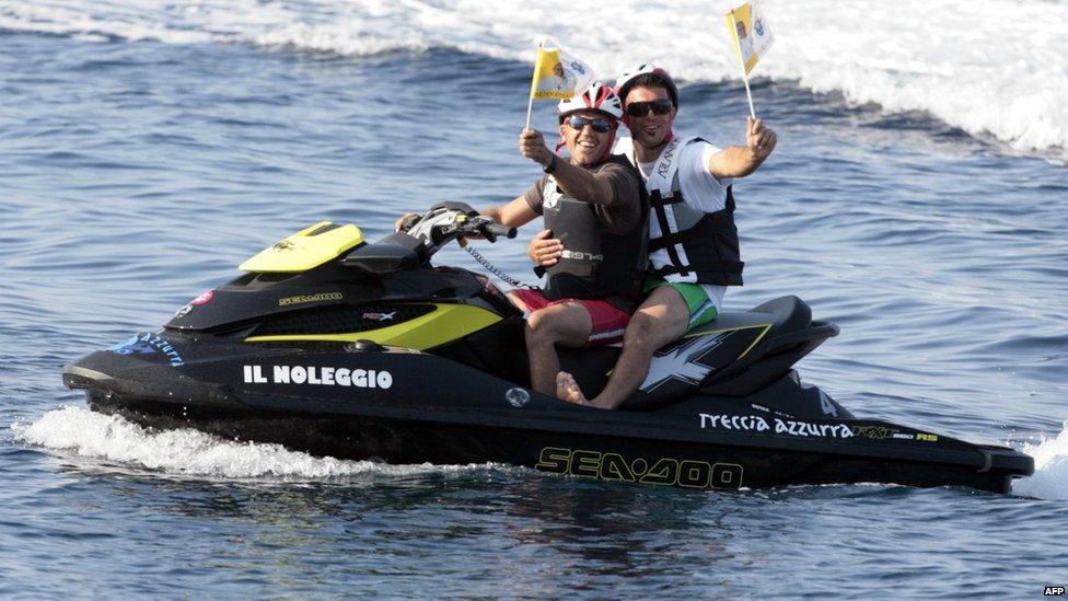 Jetski riders welcome the Pope to Lampedusa