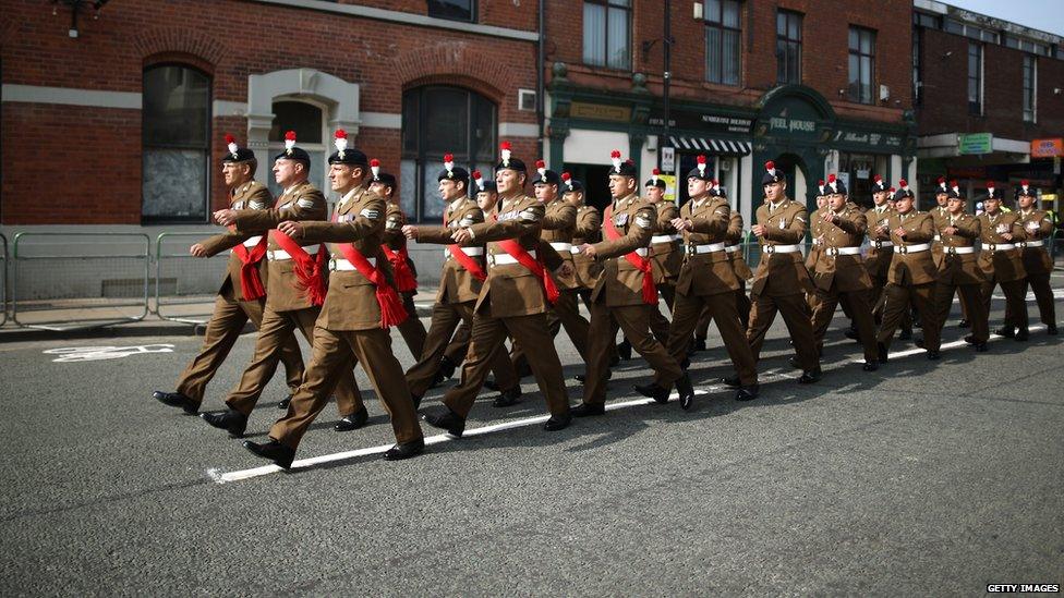 Members of The Royal Regiment of Fusiliers march through the high street for the funeral service