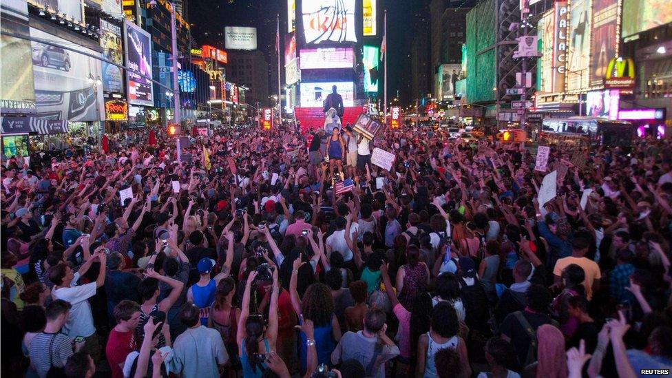 Protesters angered by George Zimmerman's acquittal fill Times Square in New York (14 July)