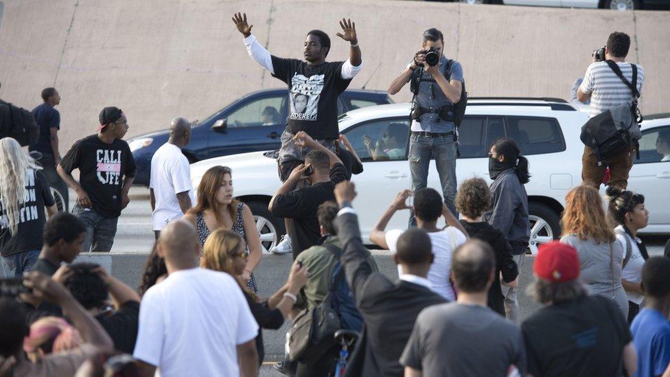 Protesters in Los Angeles stop traffic on a freeway (14 July)