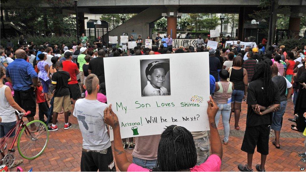 Woman holding a sign in support of Trayvon Martin in Jacksonville, Florida (14 July)