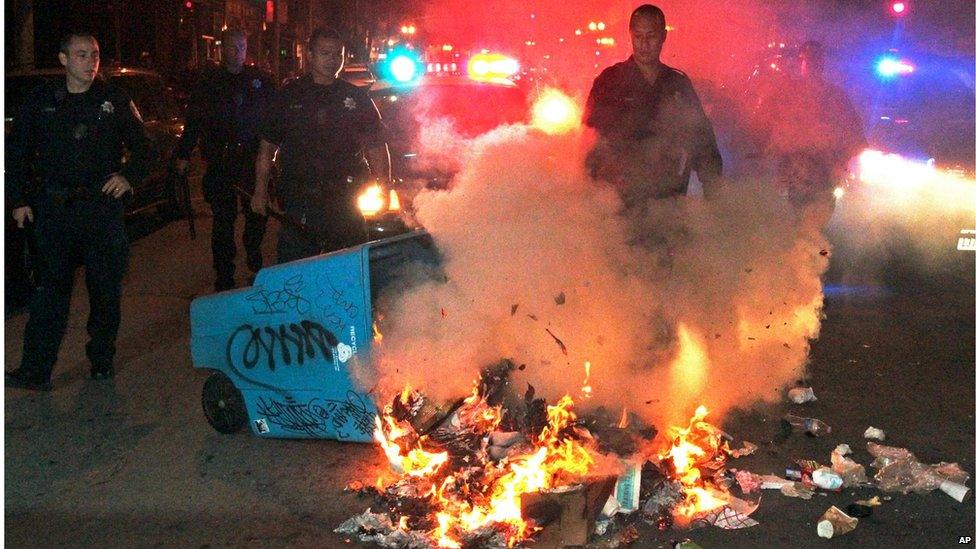 Oakland, California police put out a small fire set by protesters angered by Zimmerman's acquittal (14 July)