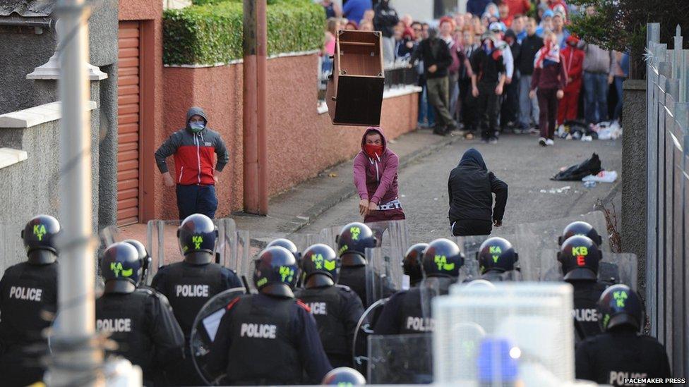 Furniture being thrown at police