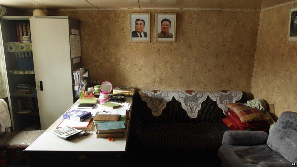 Portraits of late North Korean leaders Kim Il-sung and Kim Jong-il decorate an office aboard a North Korean-flagged ship