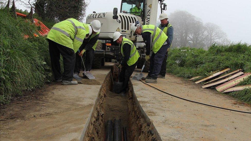 Workers laying ducts for the Jersey Electricity undersea cable Normandie 3