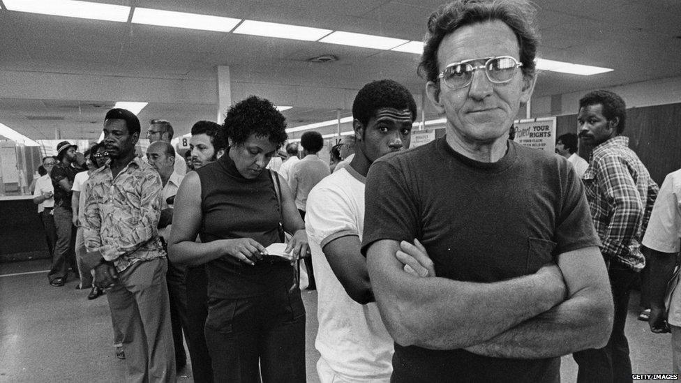 Unemployed autoworkers queuing at an unemployment office in Detroit, Michigan. Undated pic