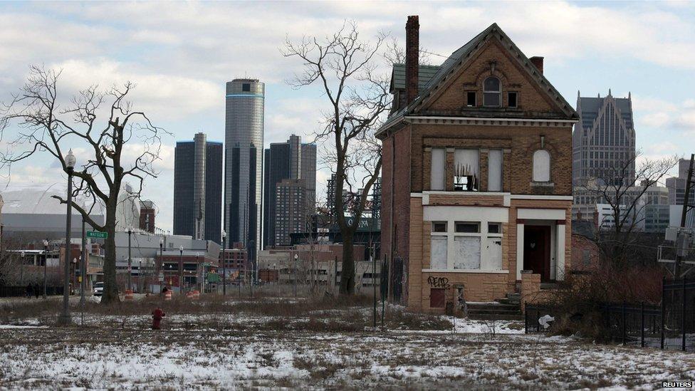 A boarded-up house is seen with the Detroit's city-centre skyline behind it. File photo from March 2013