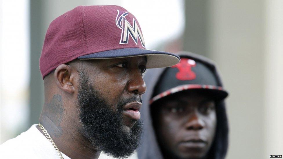 Tracy Martin, father of Trayvon Martin, stands next to his nephew Stephen Martin (r) during a rally for his son in Miami 20 July 2013