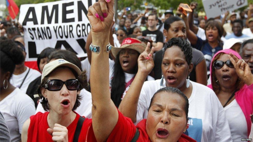 People attend a rally led by Tracy Martin, father of Trayvon Martin, in Miami 20 July 2013