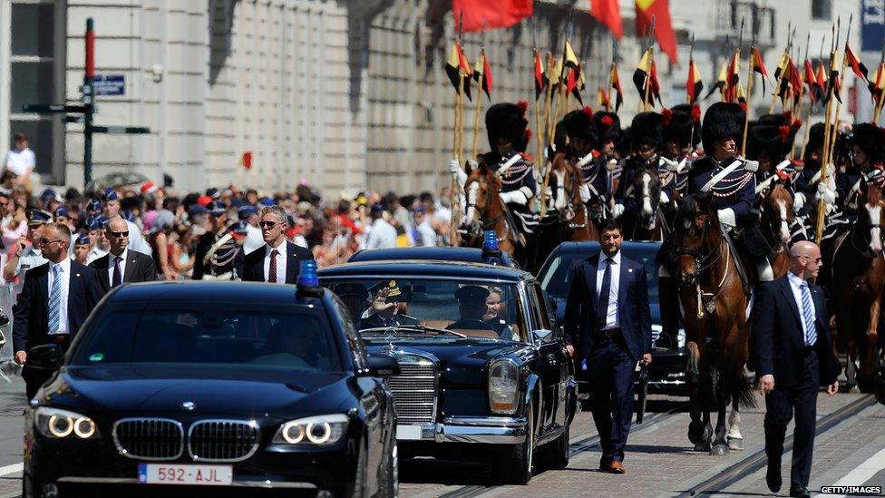 King Philippe and Queen Mathilde are driven to the Royal Palace in Brussels, 21 July 2013