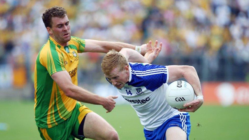 Donegal's Eamonn McGee attempts to halt the progress of Monaghan's Kieran Hughes at Clones