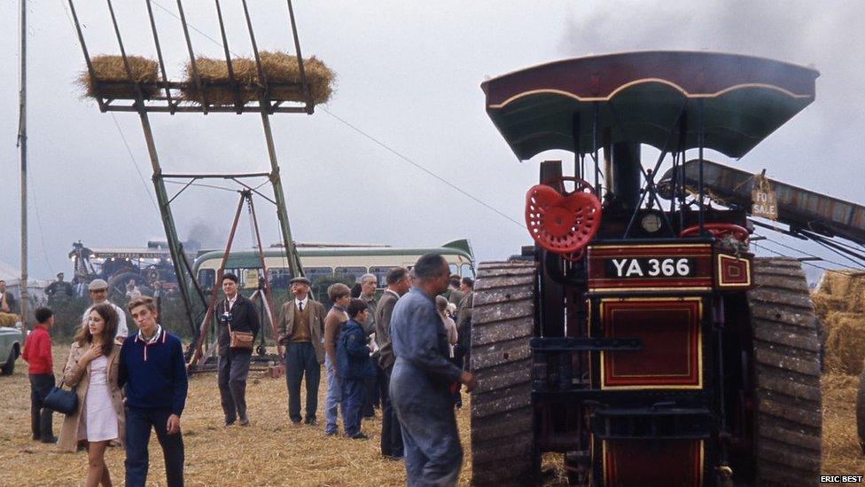 Crowds and vintage vehicles at 1968 fair