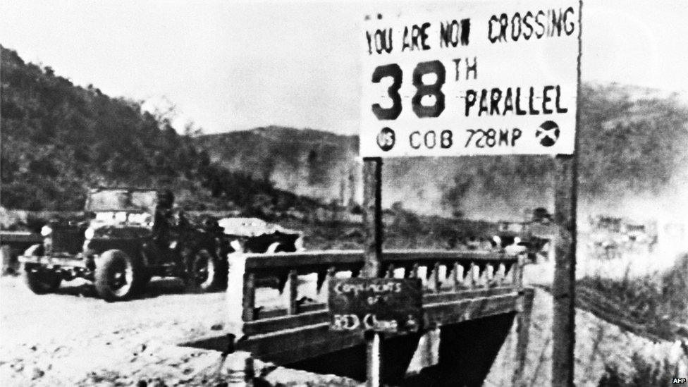 A jeep of the United Nations forces withdrawing from Pyongyang, the North Korean capital, crosses the 38th parallel in December 1950.