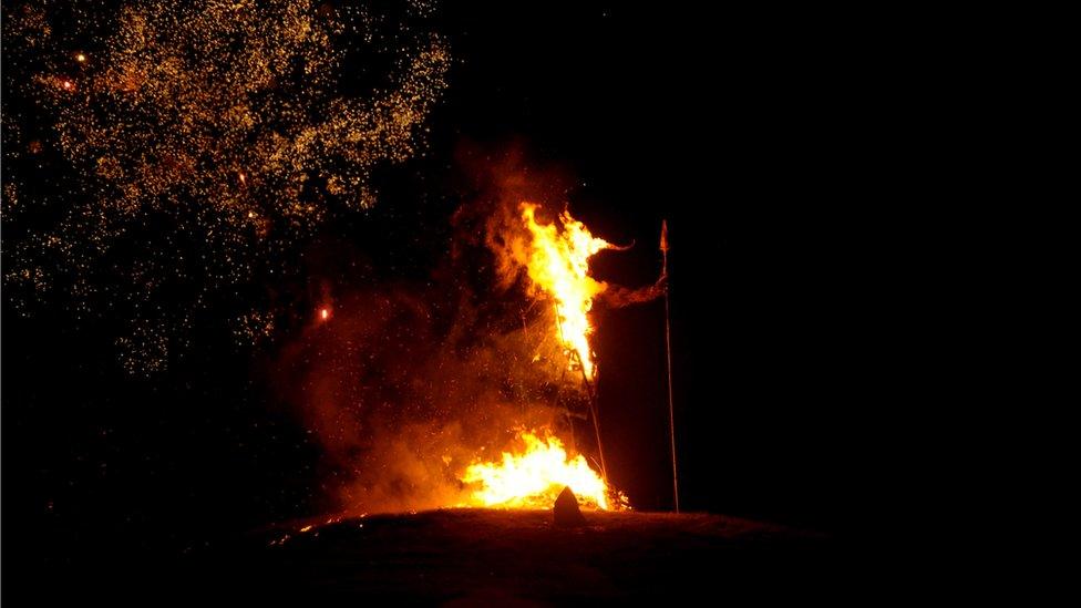 Burning wicker statue