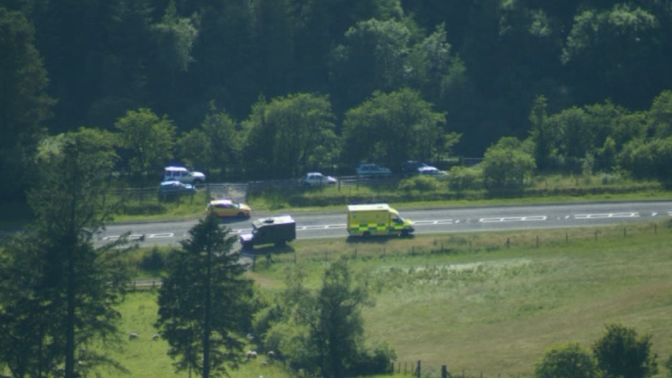 Military and emergency vehicles at the scene of the deaths in the Brecon Beacons