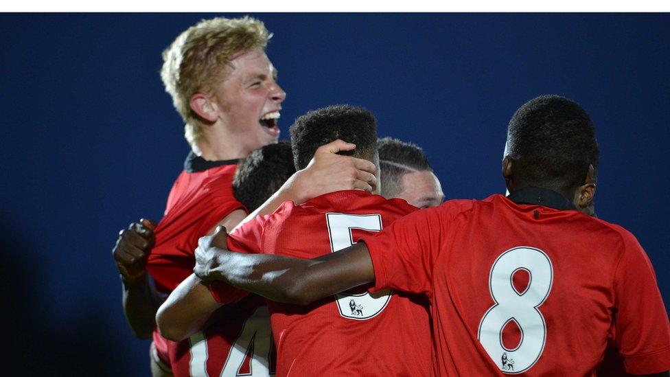 Oliver McBurney is congratulated after scoring Manchester United's last-minute winner against County Tyrone in the Premier section