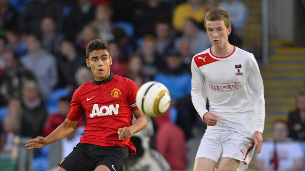 Andreas Hoelgebaum Pereira distributes the ball as James Edgar looks on during the Premier final