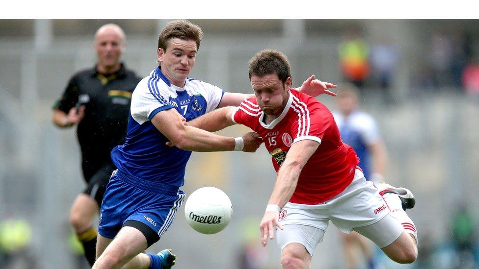 Dessie Mone challenges Martin Penrose during Tyrone's win over Monaghan in the first All-Ireland quarter-final