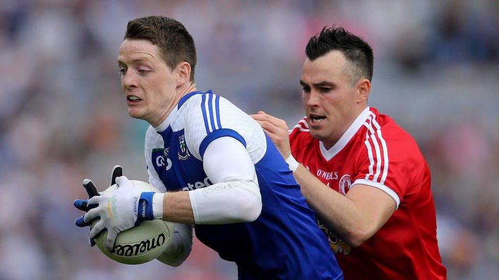 Conor Hughes and Cathal McCarron in action during the Ulster derby in Dublin