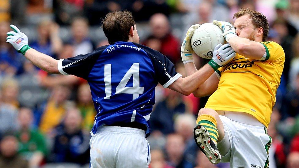 Cavan's Martin Dunne challenges Kerry goalkeeper Brendan Kealy at Croke Park