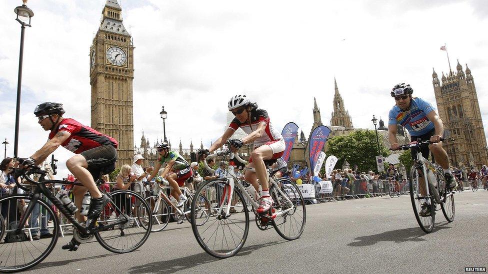 Cyclists taking part in a 100-mile race from Surrey to London