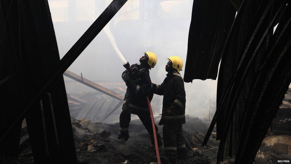 Firefighters struggle to put out a fire at the Jomo Kenyatta International Airport in Kenya"s capital Nairobi 7 August 2013.