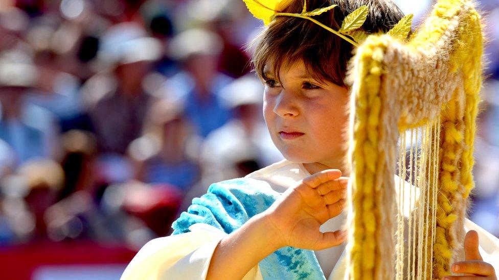 Child playing the role of an angel