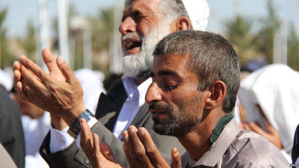 Men offering prayers. Photo: Amir in Zahedan Iran