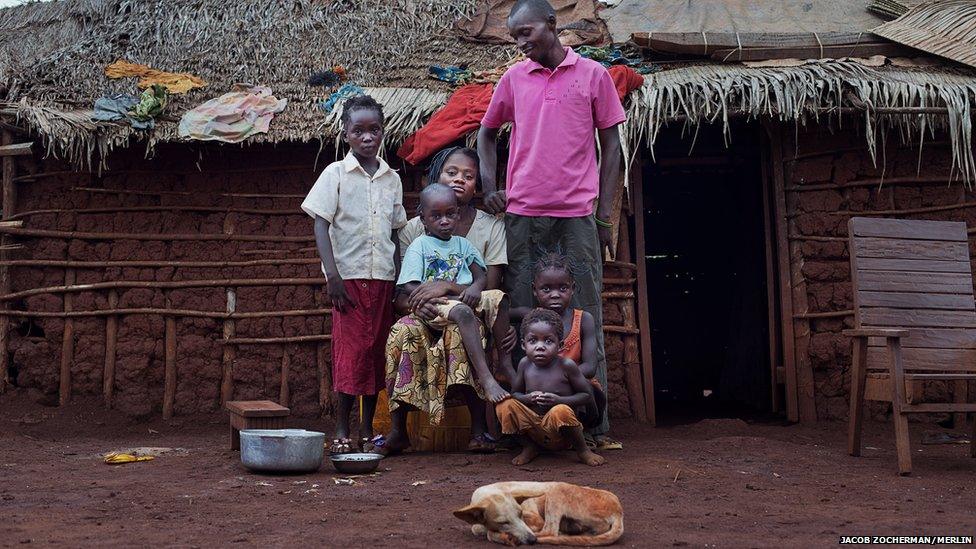 Congolese nurse Anatole Nzu with his wife and four of his six children at their house in the Batalimo refugee camp, Central African Republic