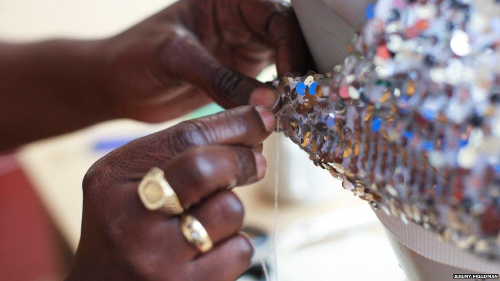 Close-up of woman sewing sequins