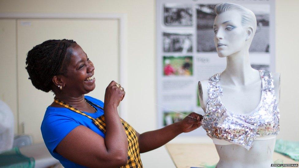 Woman sewing a top for Notting Hill Carnival