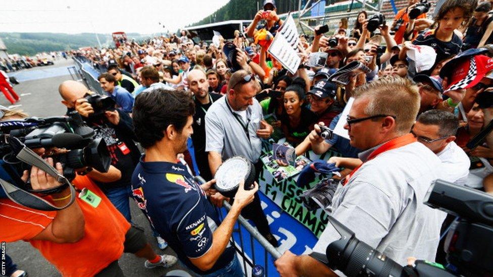 Mark Webber signs autograph for fans