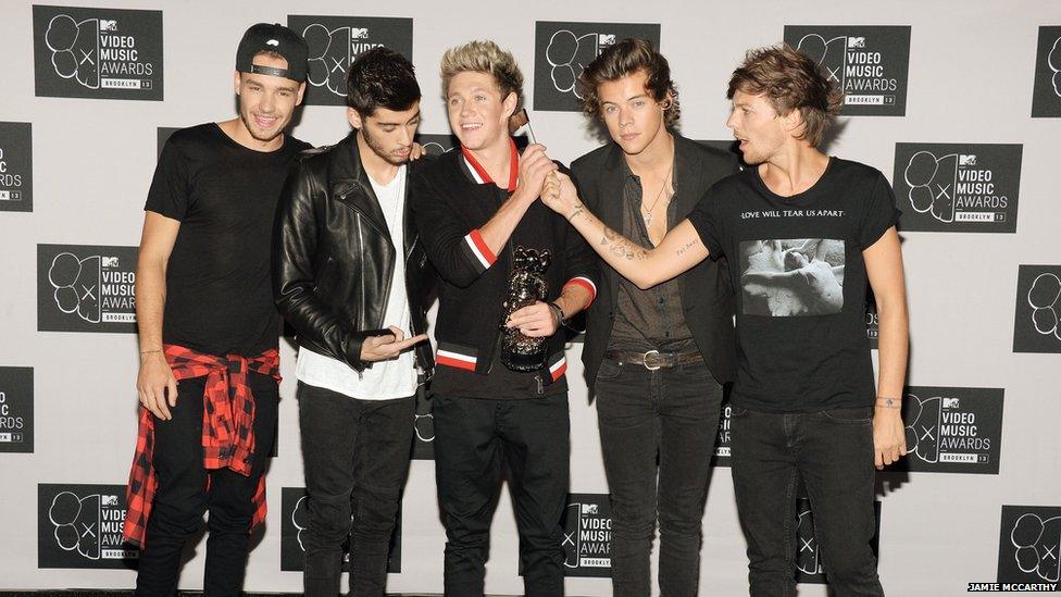 One Direction boys pose for a photograph