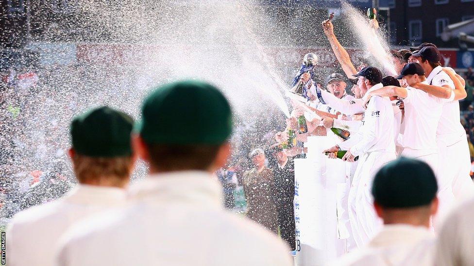 The green caps of Australia look on as England celebrate. England have now won four of the last five Ashes series.