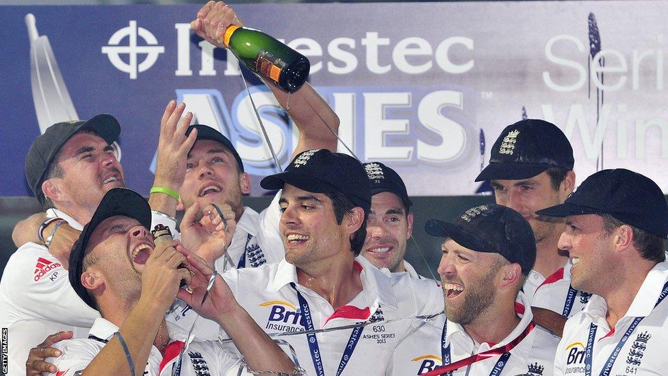 Jonathan Trott, who scored two half-centuries in the series, holds the replica urn as his team-mates look on.