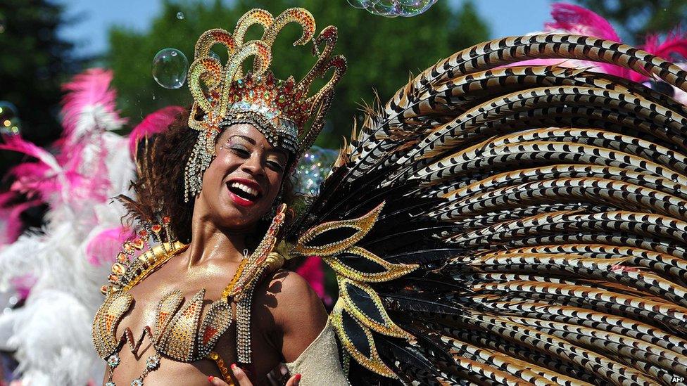 A woman taking part in a carnival procession