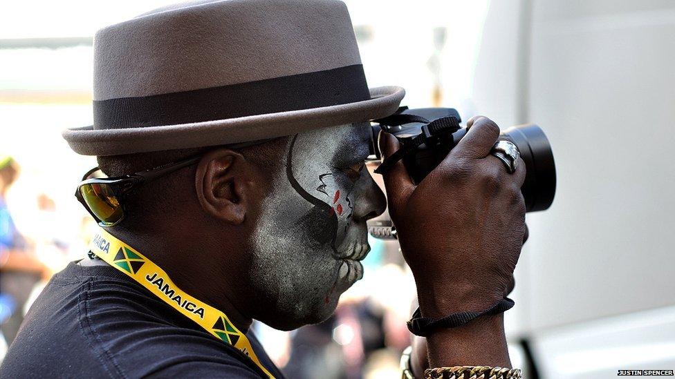 A performer takes a photo. Photo: Justin Spencer