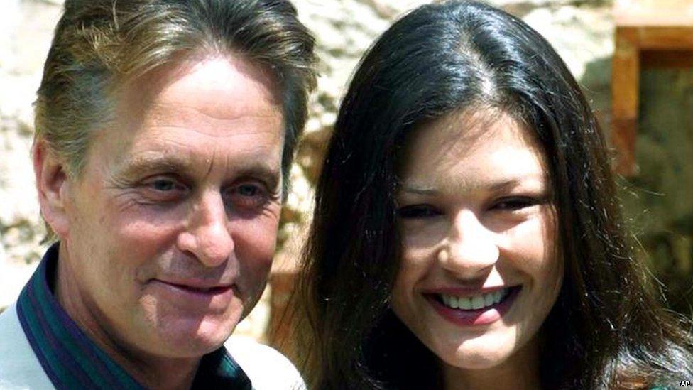 US actor Michael Douglas poses during a photo call with his actress wife Catherine Zeta Jones, during a presentation for proposed summer concerts in Valdemosa, on the island of Mallorca, Spain, where the couple have a vacation home, Tuesday May 15, 2001. (AP Photo/Jaime Reiner)