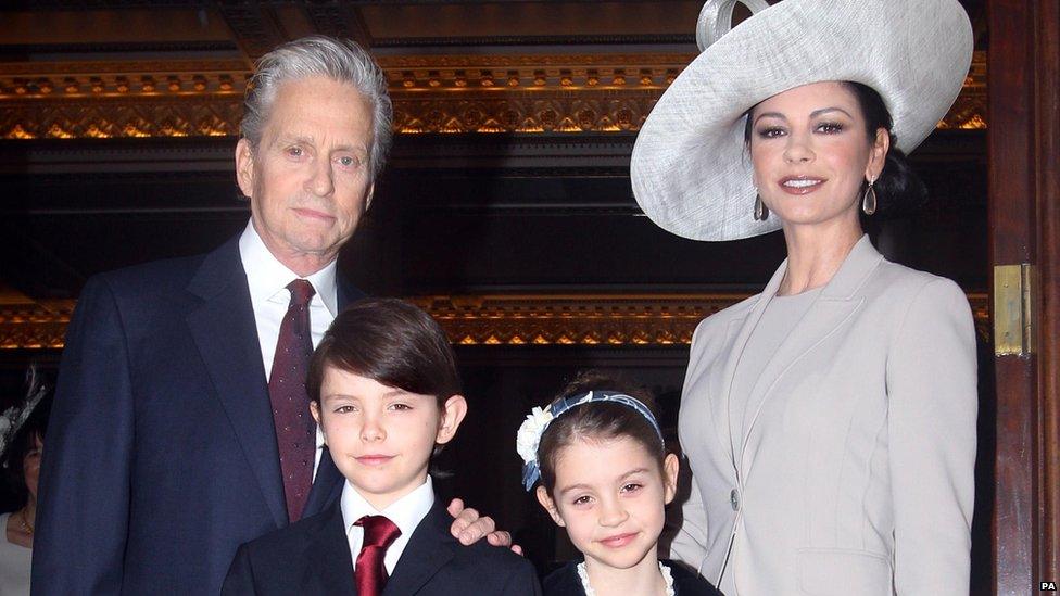 24/02/2011 Hollywood actress Catherine Zeta Jones and her husband Michael Douglas, with their children Dylan and Carys, arrive at Buckingham Palace in London where she will be made a CBE by the Prince of Wales.