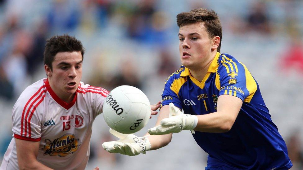 Lee Brennan tracks the progress of Shane Mannion who attempts to execute a pass for Roscommon