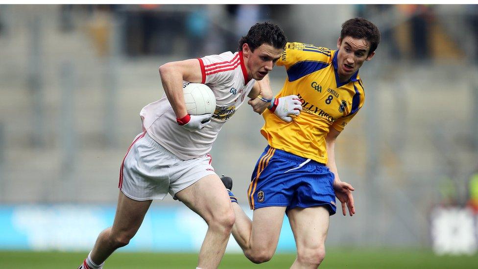 Tyrone's Ronan Nugent attempts to shrug off the attention of Roscommon's Cathal Compton