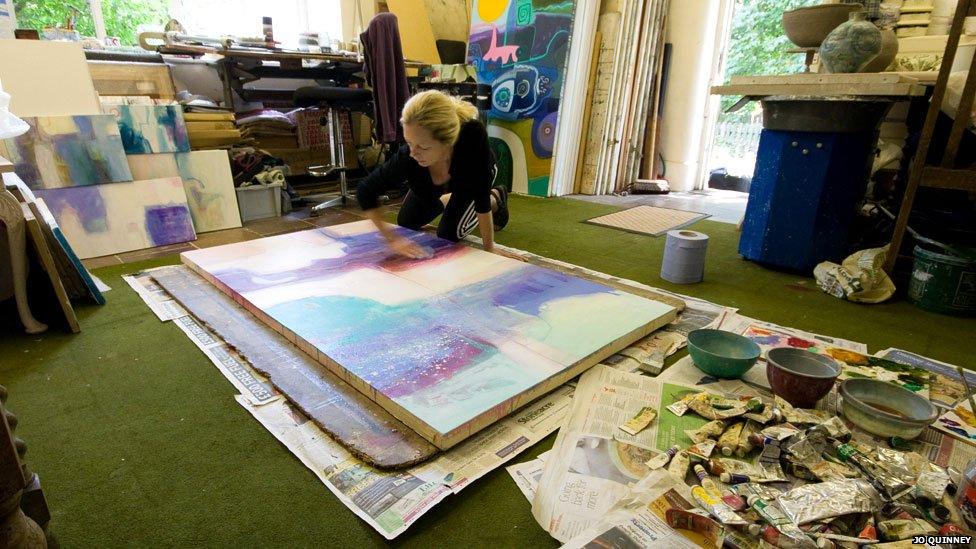 Sara-Jane Harper working on a large canvas at her studio near Wrexham