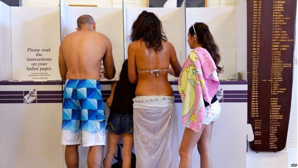 A family votes a polling station at Sydney's Bondi Beach