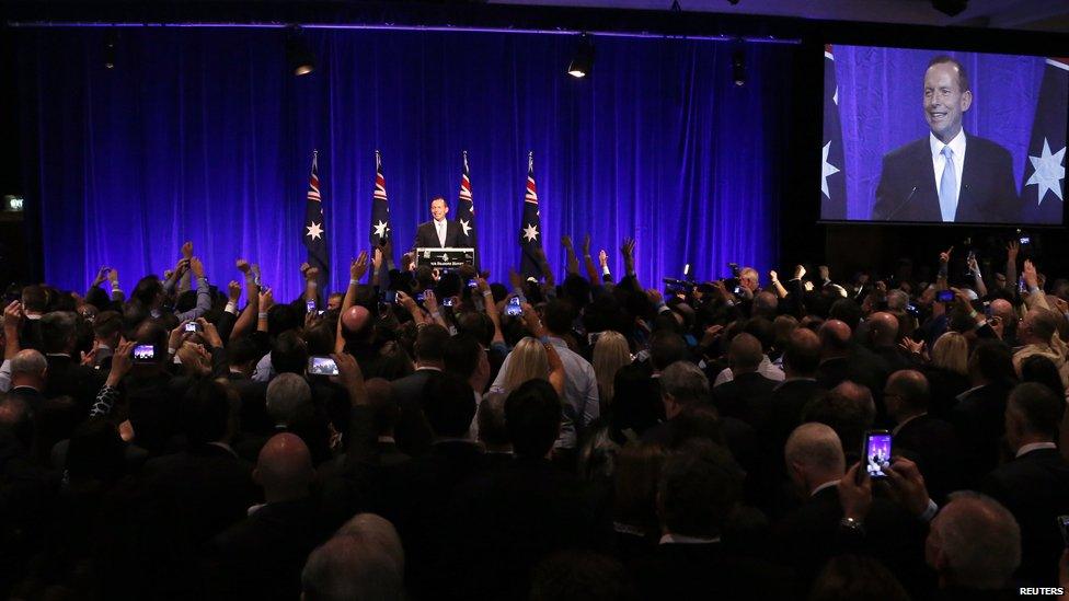 Tony Abbott (C) claims victory during an election night function in Sydney, 7 September