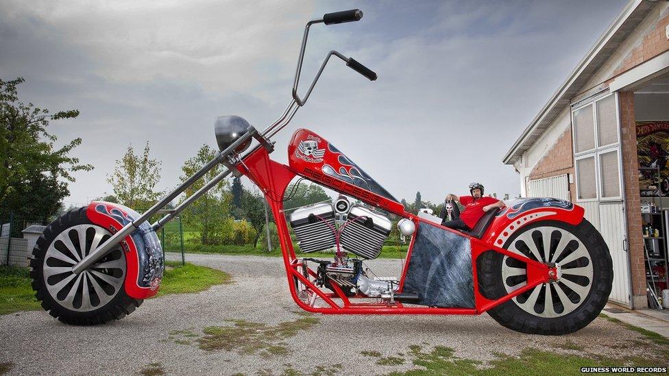 A man on an enormous motorbike.