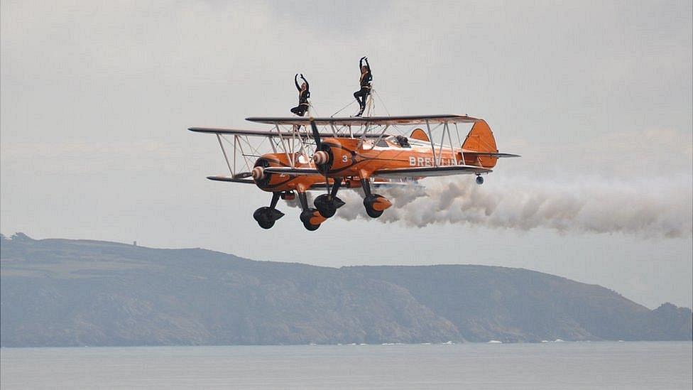 The wingwalkers at the Guernsey Air Display 2013 in front of Herm