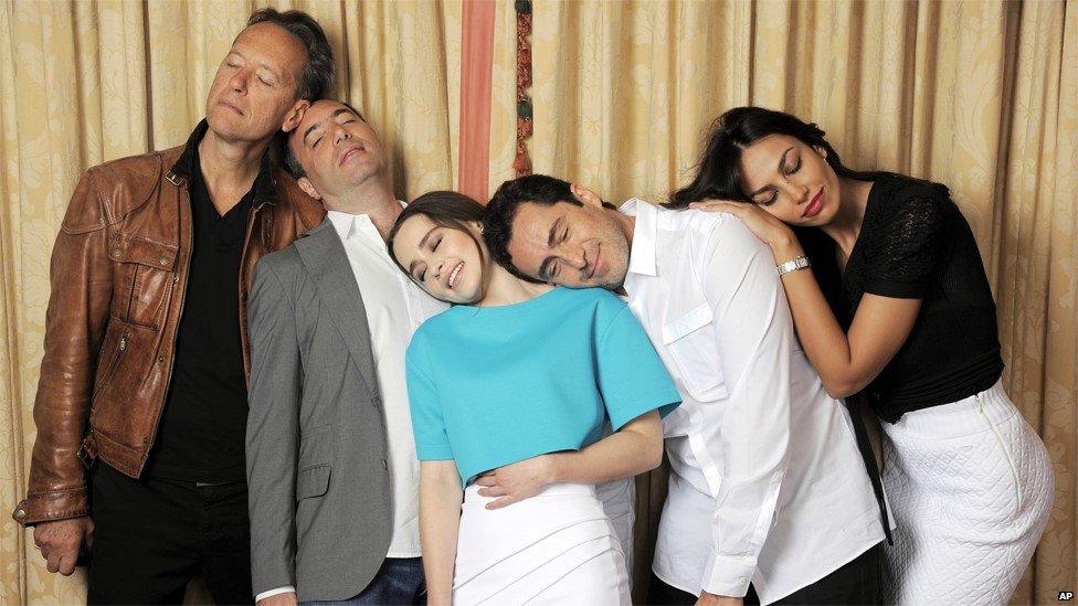 Writer-director Richard Shepard, second left, poses with cast members of his film Dom Hemingway, from left, Richard E Grant, Emilia Clarke, Demian Bichir and Madalina Diana Ghenea