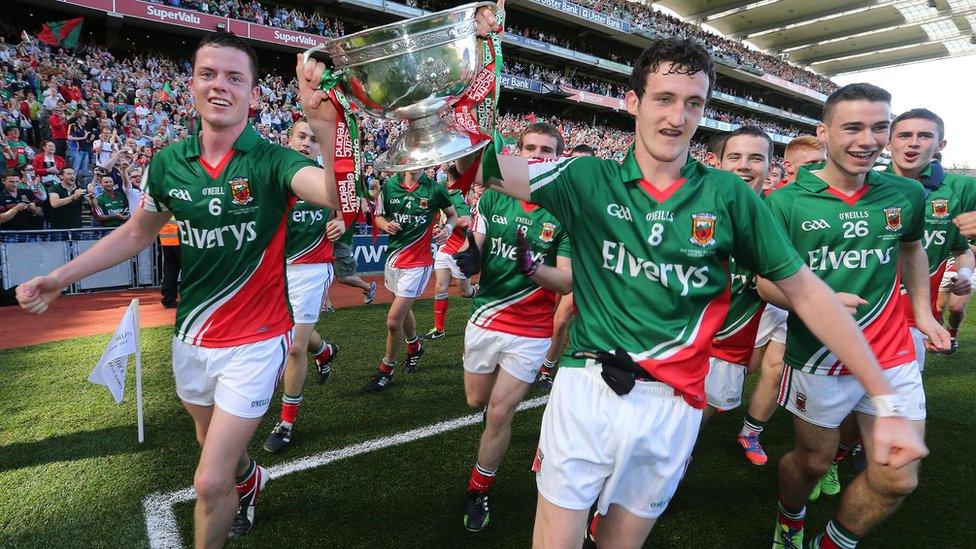 Mayo captain Stephen Coen and Val Roughneen hold the Tommy Markham Cup aloft after their victory over the Red Hands