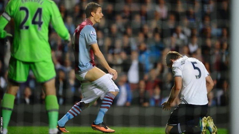 Nicklas Helenius of Aston Villa complains to the referee after having his shorts pulled down by Jan Vertonghen of Tottenham Hotspur during the Capital One Cup third round match between Aston Villa and Tottenham Hotspur at Villa Park